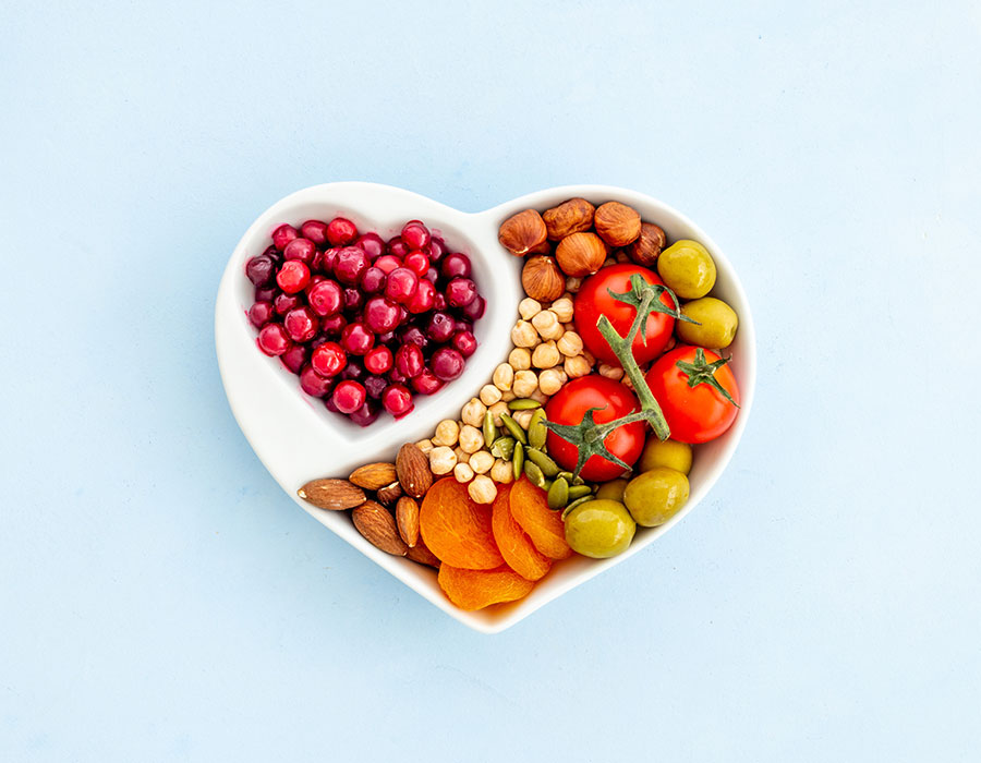Healthy food in heart shaped dish. Healthy lifestyle and nutrition eating concept.