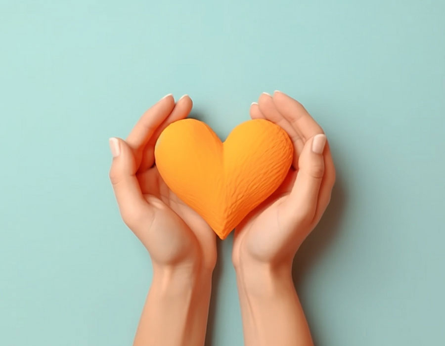 Hands making heart shape isolated on a yellow background Love and minimal fashion concept