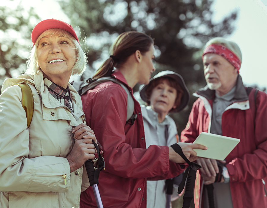Group of 4 older people hiking